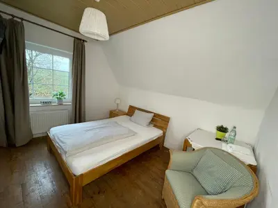 Ein Bett oder Betten in einem Zimmer der Unterkunft Landhaus Holthausen