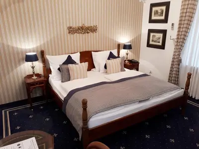 Ein Bett oder Betten in einem Zimmer der Unterkunft Boutique Hotel Windsor - The Charming City Hotels