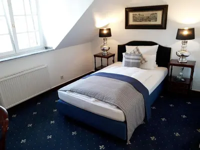 Ein Bett oder Betten in einem Zimmer der Unterkunft Boutique Hotel Windsor - The Charming City Hotels