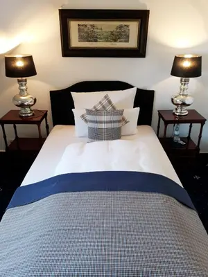 Ein Bett oder Betten in einem Zimmer der Unterkunft Boutique Hotel Windsor - The Charming City Hotels
