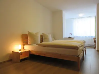 Ein Bett oder Betten in einem Zimmer der Unterkunft Hotel Hanseatic-garni
