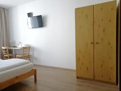 Ein Bett oder Betten in einem Zimmer der Unterkunft Hotel Hanseatic-garni