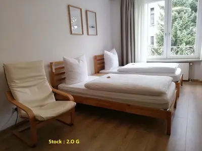 Ein Bett oder Betten in einem Zimmer der Unterkunft Hotel Hanseatic-garni