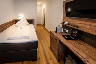 Ein Bett oder Betten in einem Zimmer der Unterkunft Landhotel Jagdschlösschen