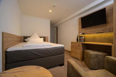 Ein Bett oder Betten in einem Zimmer der Unterkunft Landhotel Jagdschlösschen