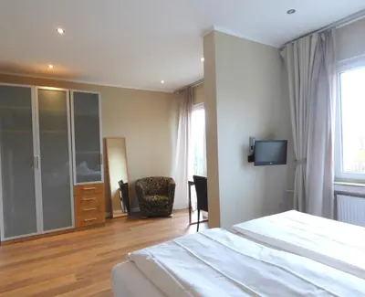 Ein Bett oder Betten in einem Zimmer der Unterkunft Hotel Akazienhof
