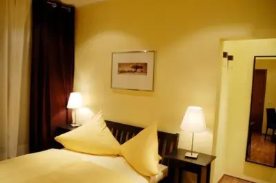 Ein Bett oder Betten in einem Zimmer der Unterkunft Hotel Akazienhof