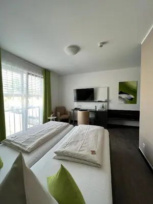 Ein Bett oder Betten in einem Zimmer der Unterkunft Campushotel