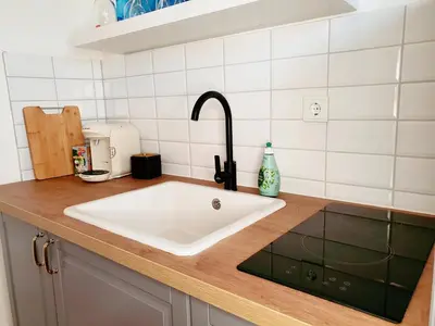 Küche/Küchenzeile in der Unterkunft Harmony Apartment