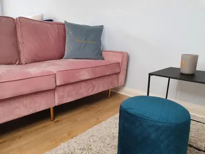 Ein Sitzbereich in der Unterkunft Harmony Apartment