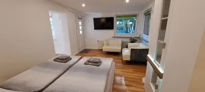 Ein Bett oder Betten in einem Zimmer der Unterkunft Bungalow an der Tanne mit überdachter Terrasse