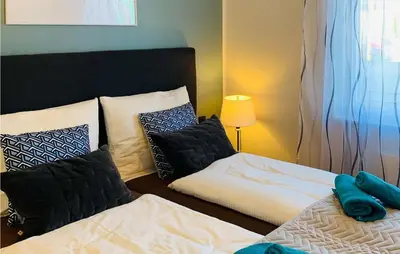 Ein Bett oder Betten in einem Zimmer der Unterkunft Nice Apartment In Mettmann With Wifi