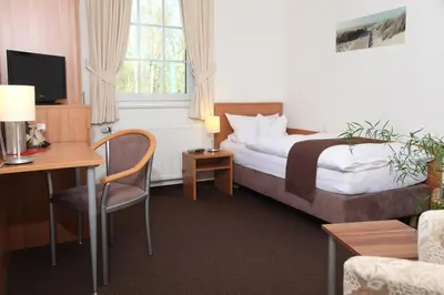 Ein Bett oder Betten in einem Zimmer der Unterkunft Hotel Fürstenberg