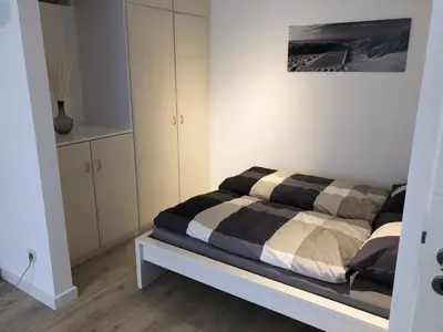Ein Bett oder Betten in einem Zimmer der Unterkunft Ferienwohnung Poppelreiter