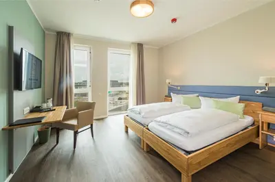Ein Bett oder Betten in einem Zimmer der Unterkunft Hotel Neues Pastorat