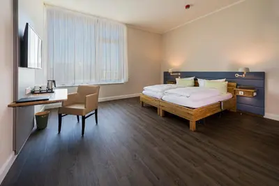 Ein Bett oder Betten in einem Zimmer der Unterkunft Hotel Neues Pastorat
