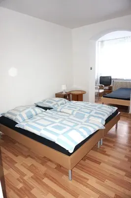 Ein Bett oder Betten in einem Zimmer der Unterkunft Artus Hotel