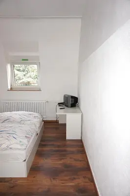 Ein Bett oder Betten in einem Zimmer der Unterkunft Artus Hotel