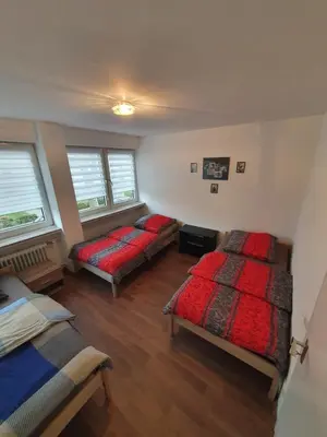 Ein Bett oder Betten in einem Zimmer der Unterkunft Ferienwohnung Schloßstraße