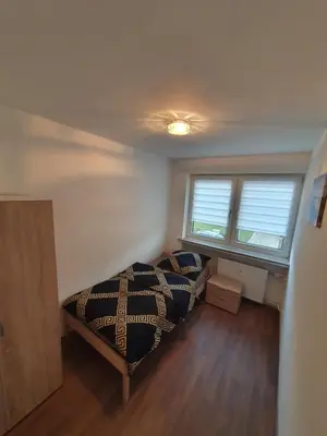 Ein Bett oder Betten in einem Zimmer der Unterkunft Ferienwohnung Schloßstraße