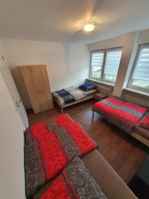 Ein Bett oder Betten in einem Zimmer der Unterkunft Ferienwohnung Schloßstraße