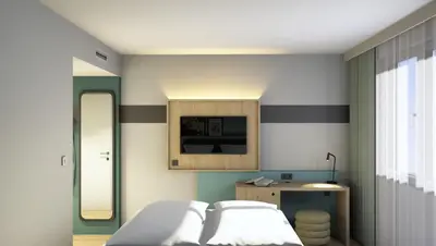 Ein Bett oder Betten in einem Zimmer der Unterkunft Spark by Hilton Essen City Centre