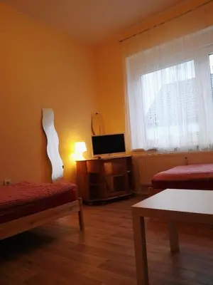 Ein Bett oder Betten in einem Zimmer der Unterkunft Zu Hause Bei Freunden