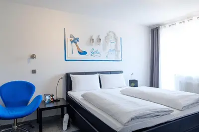 Ein Bett oder Betten in einem Zimmer der Unterkunft art Hotel Körschen