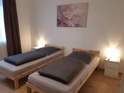Ein Bett oder Betten in einem Zimmer der Unterkunft Herzmensch Oberhausen