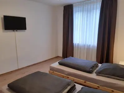 Ein Bett oder Betten in einem Zimmer der Unterkunft Herzmensch Oberhausen