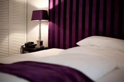 Ein Bett oder Betten in einem Zimmer der Unterkunft Hotel Aleksandra