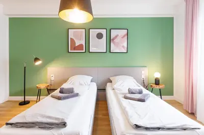 Ein Bett oder Betten in einem Zimmer der Unterkunft Glück Auf Appartements Hufelandstraße Essen