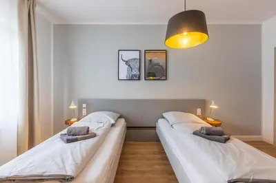 Ein Bett oder Betten in einem Zimmer der Unterkunft Glück Auf Appartements Hufelandstraße Essen