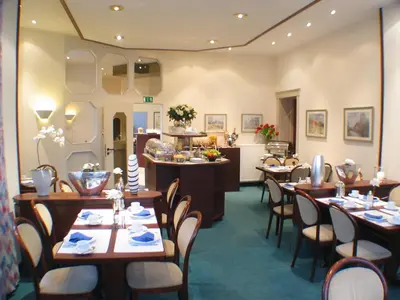 Ein Sitzbereich in der Unterkunft Astoria Hotel