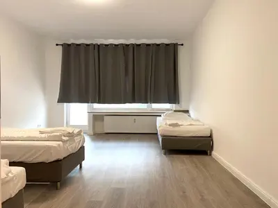 Ein Bett oder Betten in einem Zimmer der Unterkunft Gerresheimer Republic