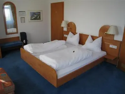 Ein Bett oder Betten in einem Zimmer der Unterkunft Hotel Daun