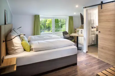 Ein Bett oder Betten in einem Zimmer der Unterkunft OlfenLodge