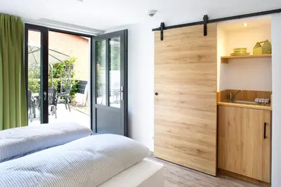 Ein Bett oder Betten in einem Zimmer der Unterkunft OlfenLodge