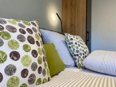 Ein Bett oder Betten in einem Zimmer der Unterkunft OlfenLodge