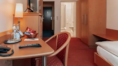 Ein Bett oder Betten in einem Zimmer der Unterkunft Avantgarde Hotel