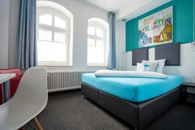 Ein Bett oder Betten in einem Zimmer der Unterkunft Hotel Stadt Lüdenscheid