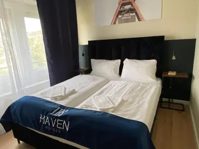 Ein Bett oder Betten in einem Zimmer der Unterkunft Haven Hotel - Wuppertal