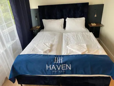 Ein Bett oder Betten in einem Zimmer der Unterkunft Haven Hotel - Wuppertal