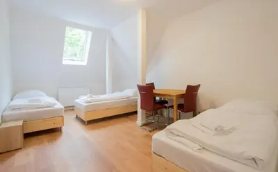 Ein Bett oder Betten in einem Zimmer der Unterkunft PRIME Apartments - Monteur House with 1-4 Room Apartments