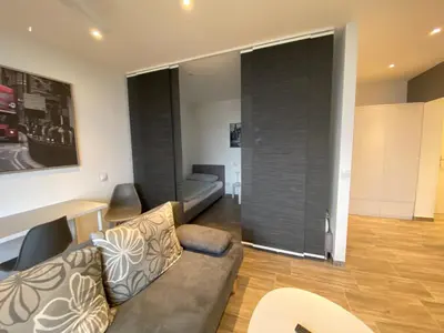 Ein Sitzbereich in der Unterkunft Modernes Apartment Duisburg Homberg