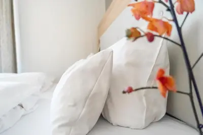 Ein Bett oder Betten in einem Zimmer der Unterkunft Ambient Hotel Zum Schwan