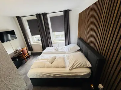 Ein Bett oder Betten in einem Zimmer der Unterkunft BFF Airport Messe Schlaf - Düsseldorf