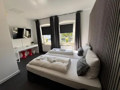Ein Bett oder Betten in einem Zimmer der Unterkunft BFF Airport Messe Schlaf - Düsseldorf