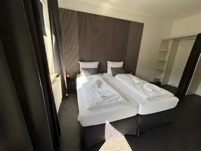 Ein Bett oder Betten in einem Zimmer der Unterkunft BFF Airport Messe Schlaf - Düsseldorf