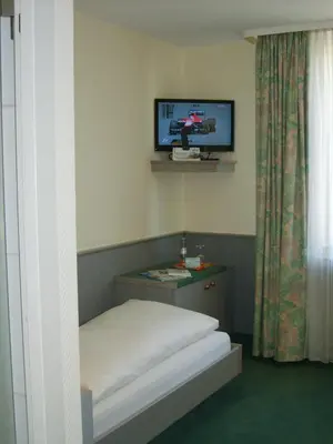 Ein Bett oder Betten in einem Zimmer der Unterkunft City Hotel by celina